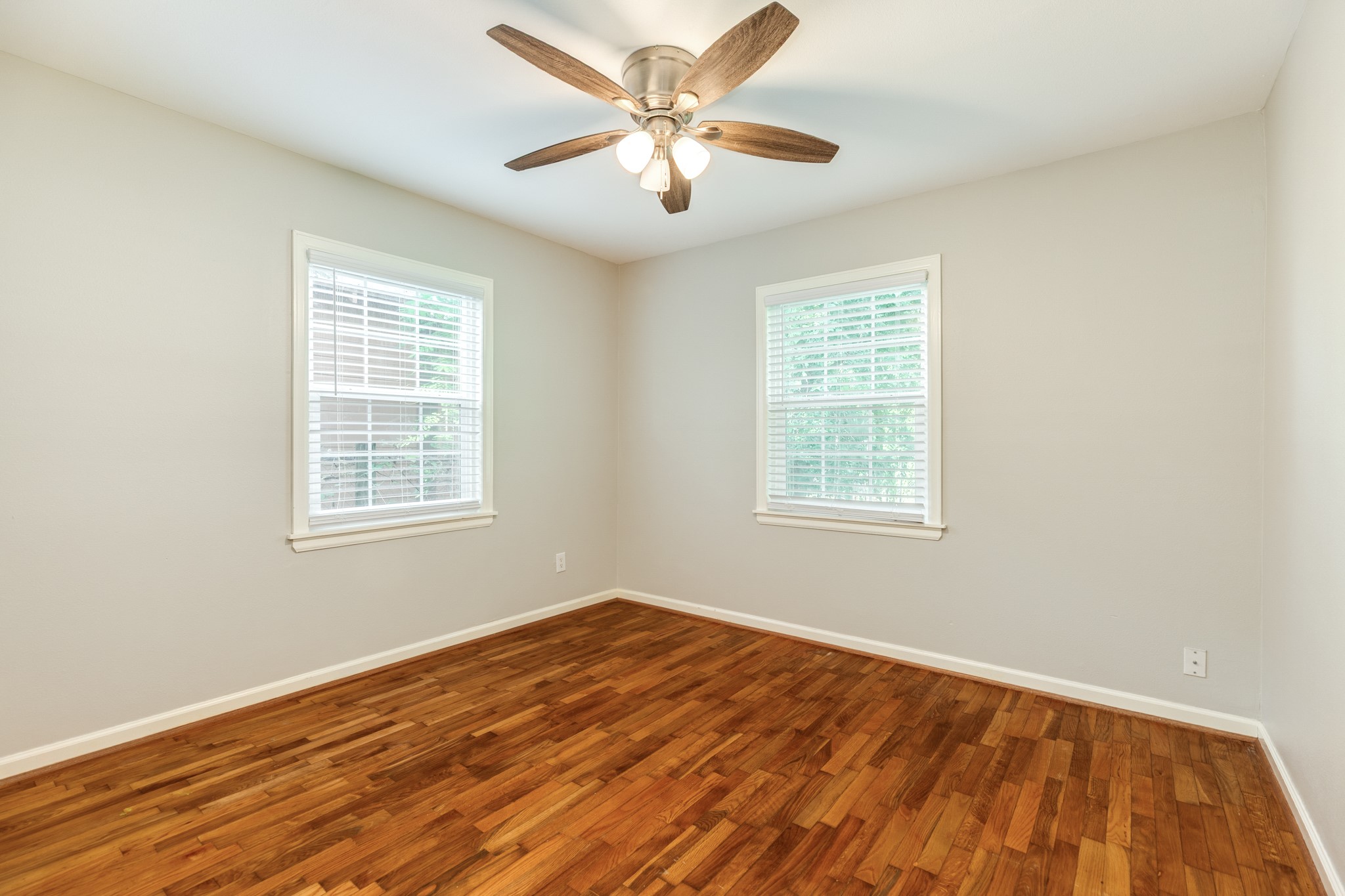 840 South Morgan Street Angleton, TX 77515 - Photo 21 of 28 a view of a room with wooden floor and a window