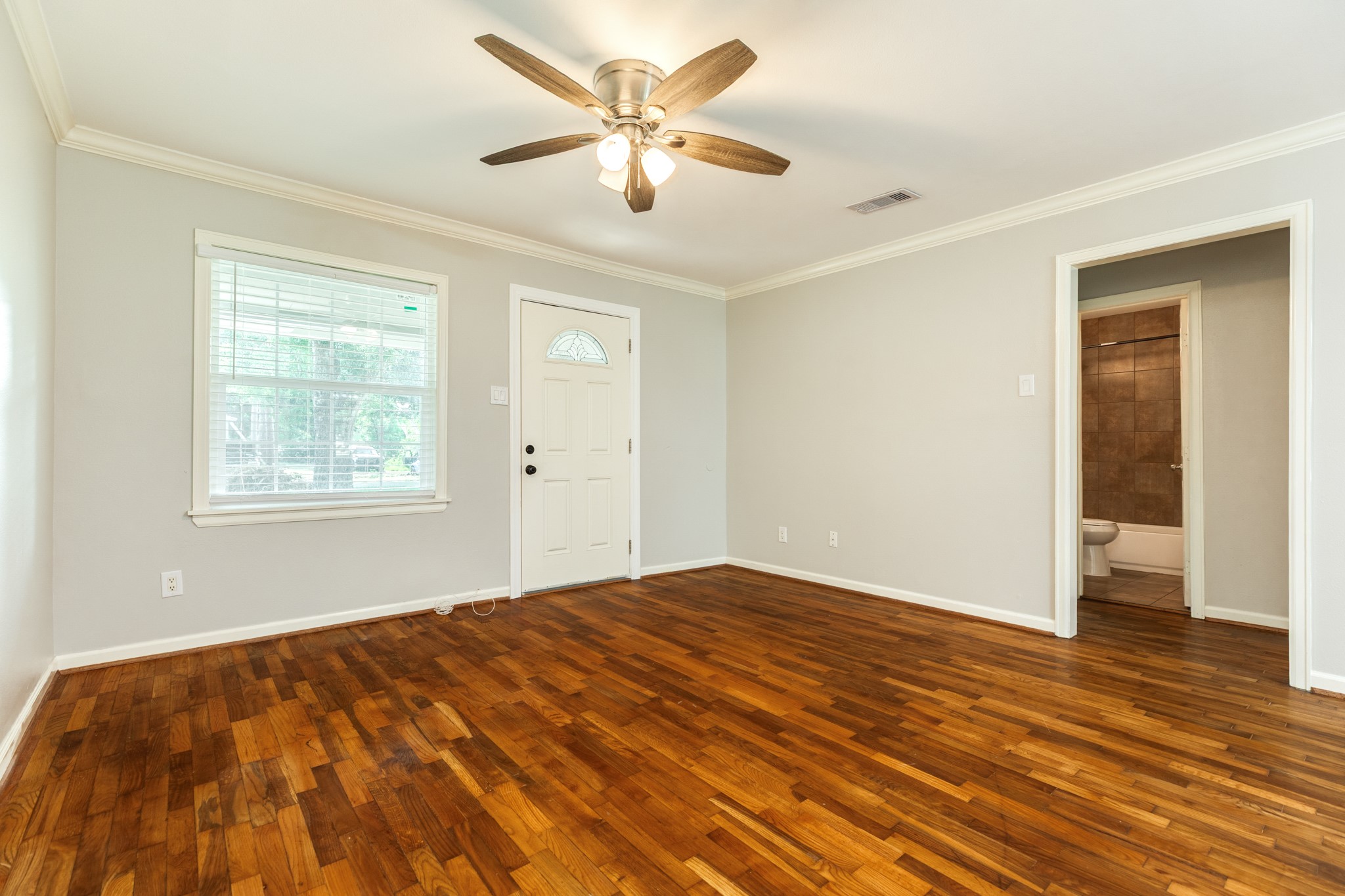 840 South Morgan Street Angleton, TX 77515 - Photo 8 of 28 a bedroom with a bed and a window
