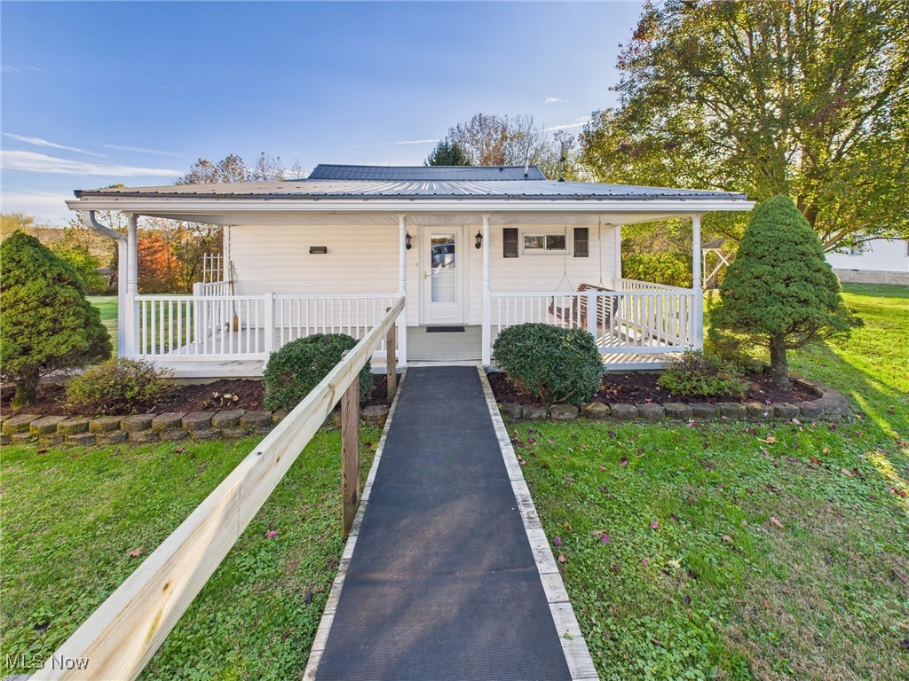 207 Stone Oak Road Davisville, WV 26142 - Photo 13 of 22 View of front of home featuring covered porch, a ramp, and a metal roof