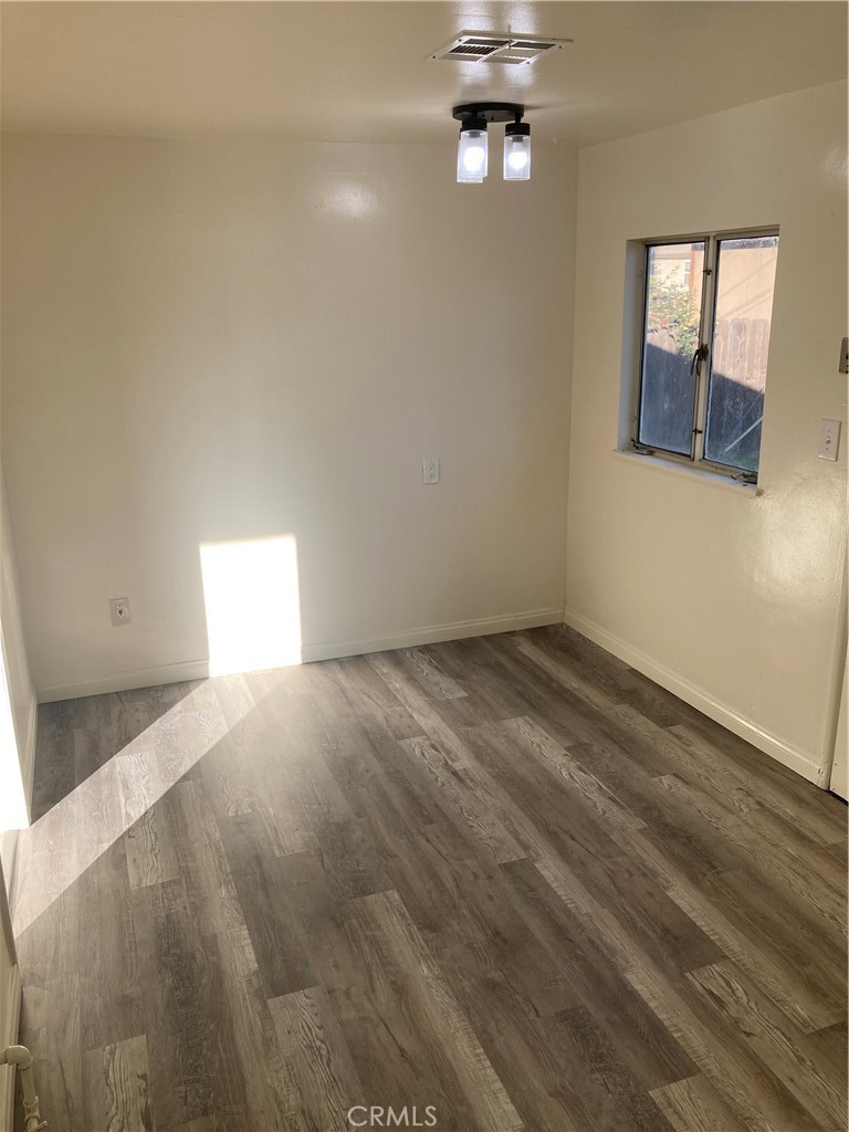 980 West C West Colton, CA 92324 - Photo 2 of 9 an empty room with a empty space and windows