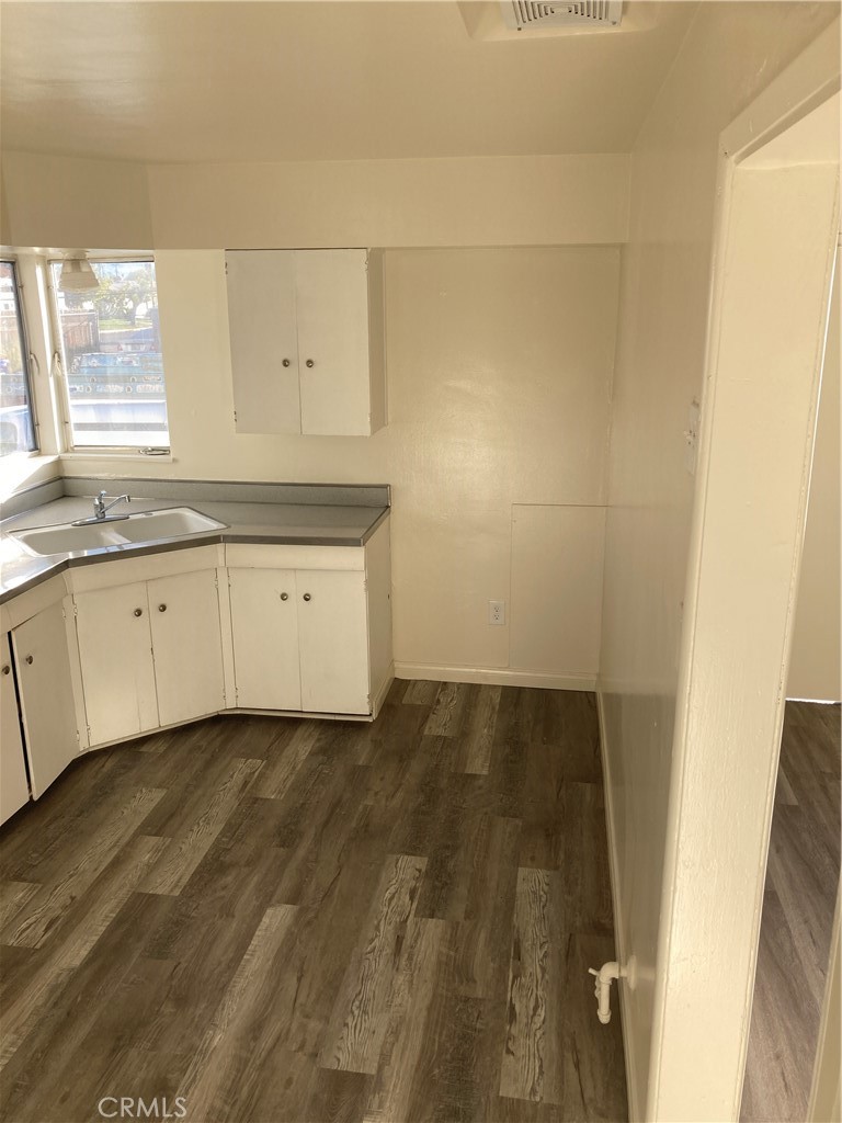 980 West C West Colton, CA 92324 - Photo 3 of 9 a view of a kitchen with wooden floor