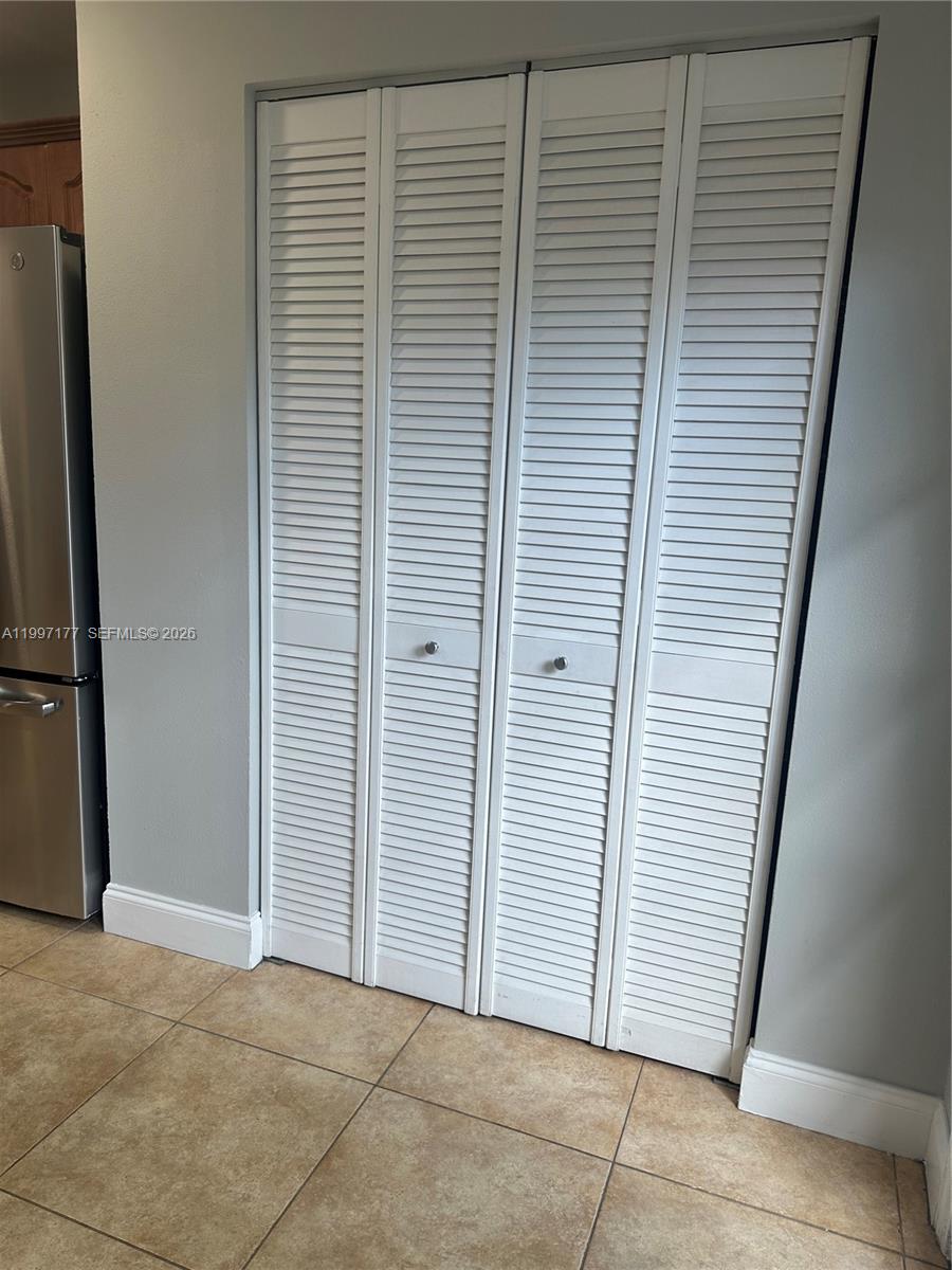 9724 Southwest 142nd Place Miami, FL 33186 - Photo 11 of 36 a view of a livingroom with closet