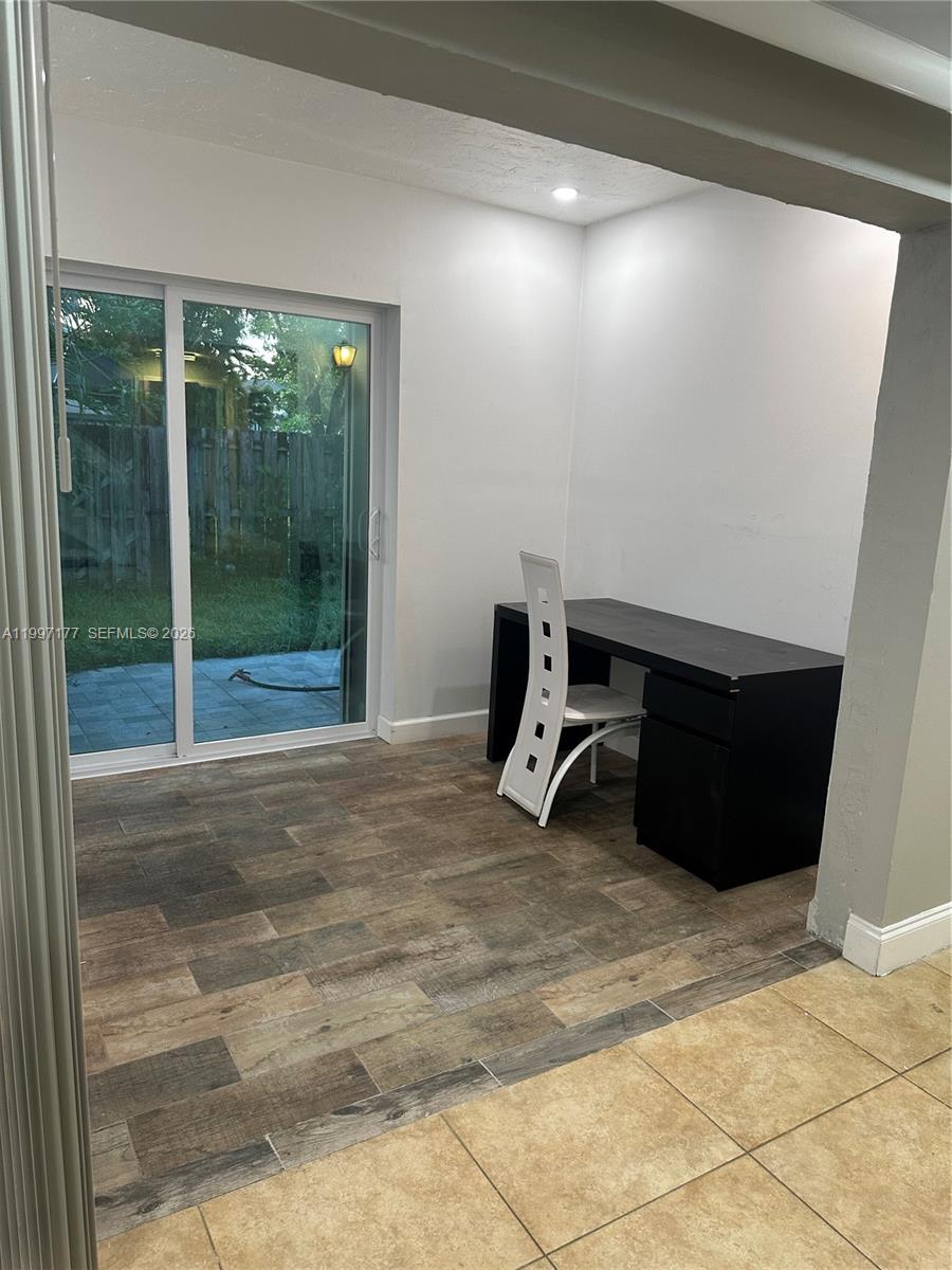 9724 Southwest 142nd Place Miami, FL 33186 - Photo 14 of 36 a room with a yard