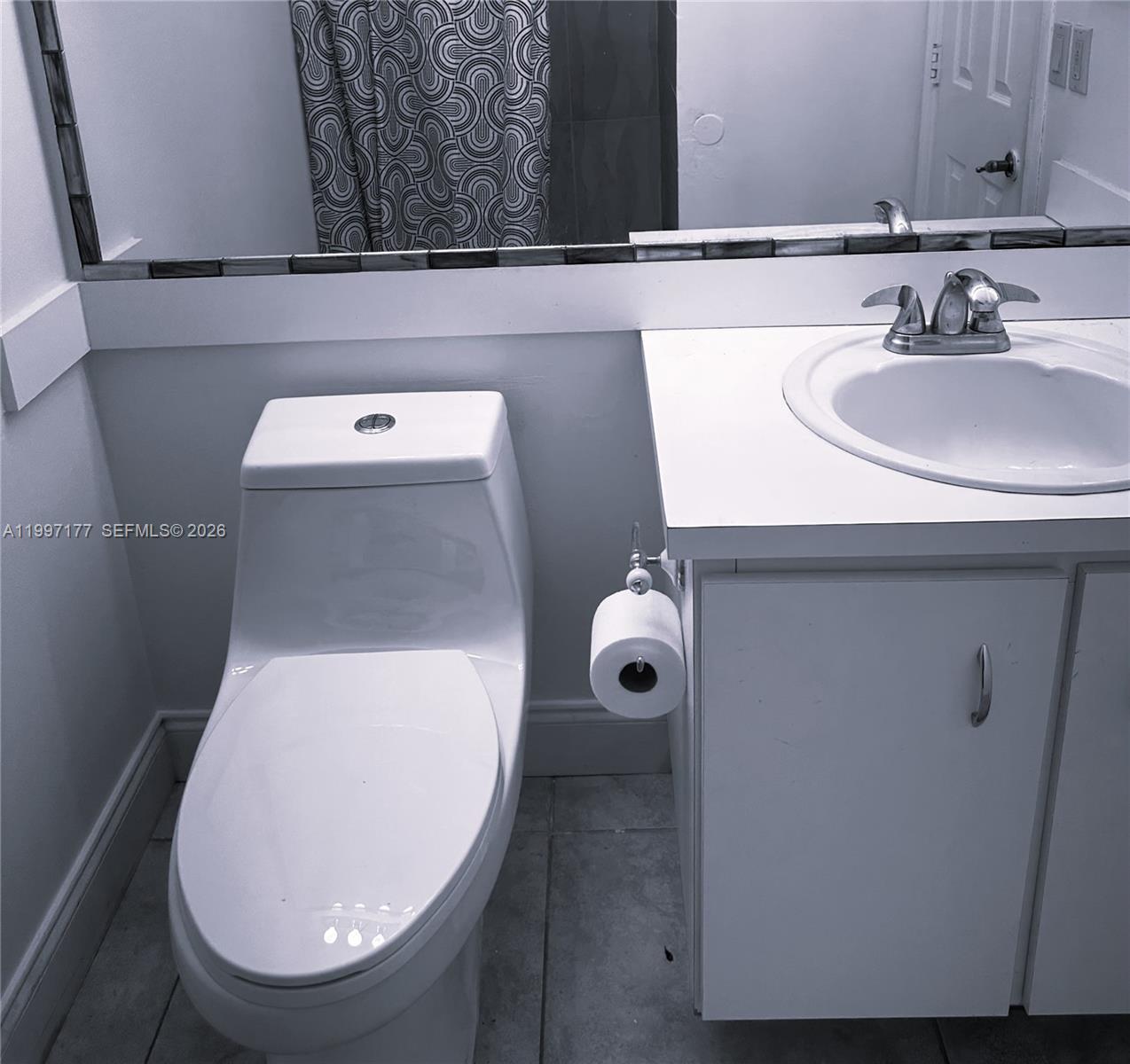 9724 Southwest 142nd Place Miami, FL 33186 - Photo 15 of 36 a bathroom with a toilet and a sink