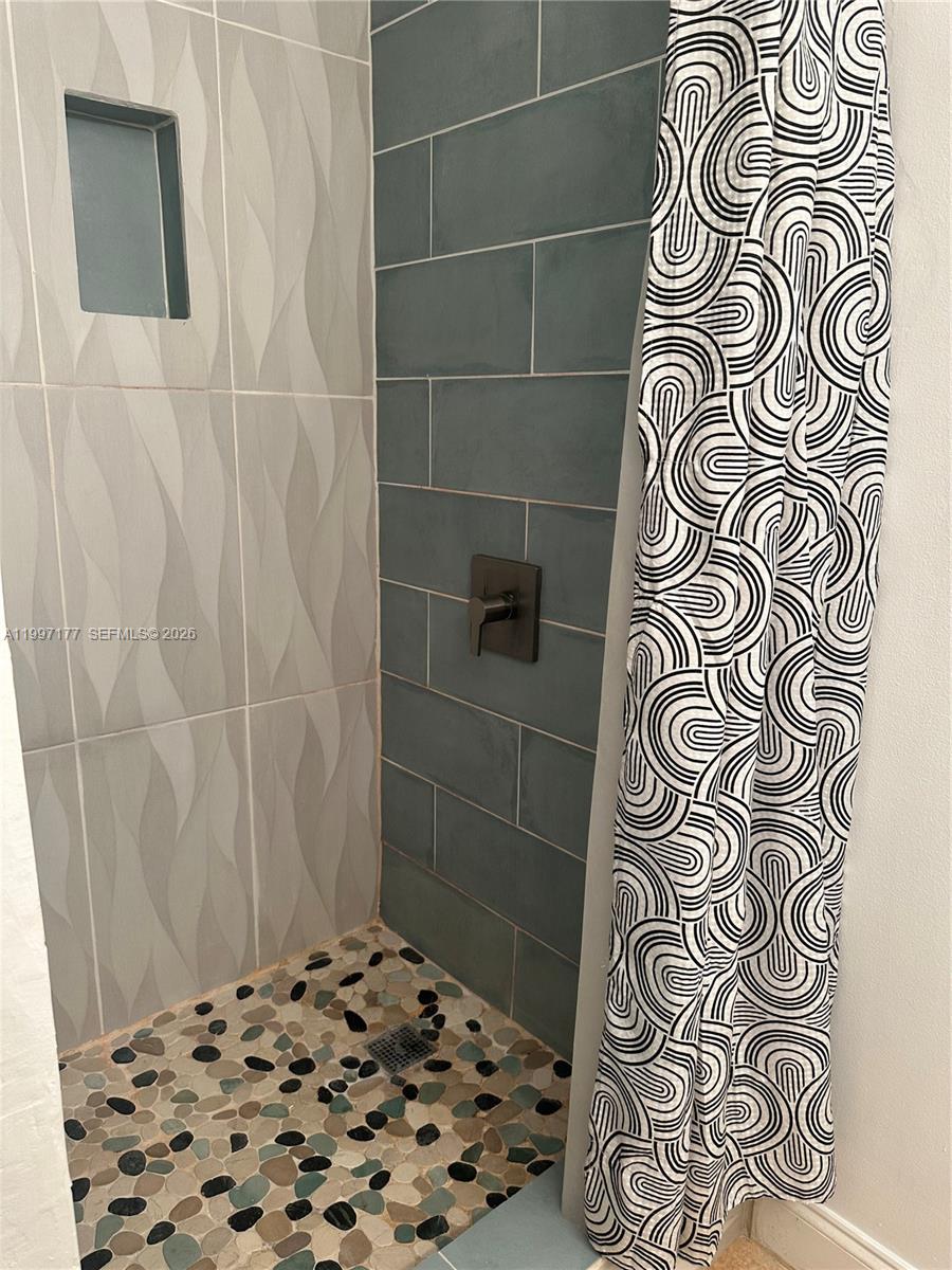 9724 Southwest 142nd Place Miami, FL 33186 - Photo 16 of 36 a bathroom with a shower