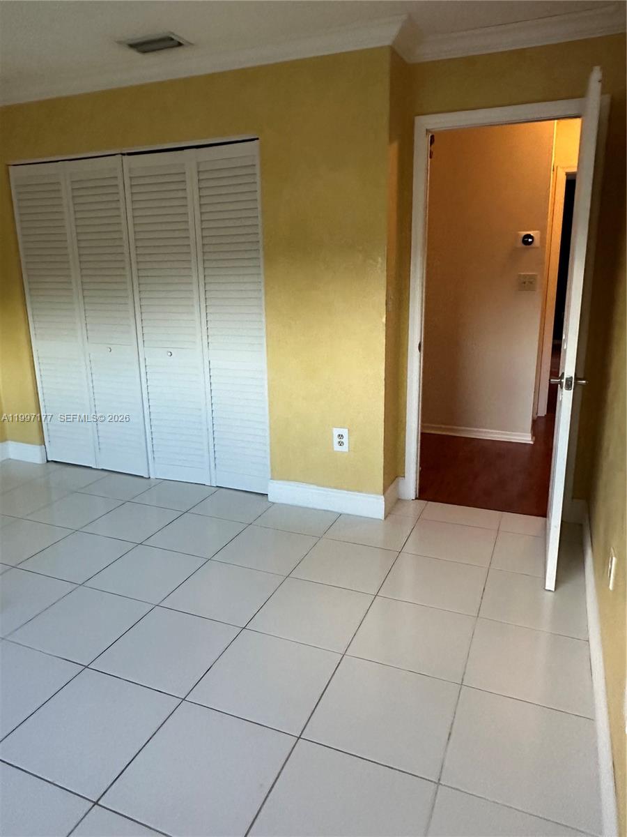 9724 Southwest 142nd Place Miami, FL 33186 - Photo 24 of 36 an empty room with a bathroom