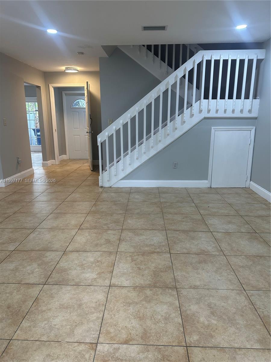 9724 Southwest 142nd Place Miami, FL 33186 - Photo 3 of 36 a view of staircase with white walls