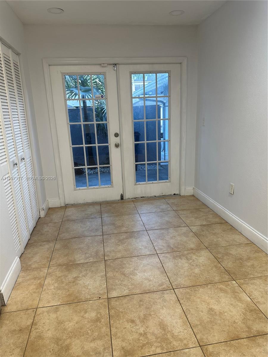 9724 Southwest 142nd Place Miami, FL 33186 - Photo 6 of 36 a view of an empty room with a window