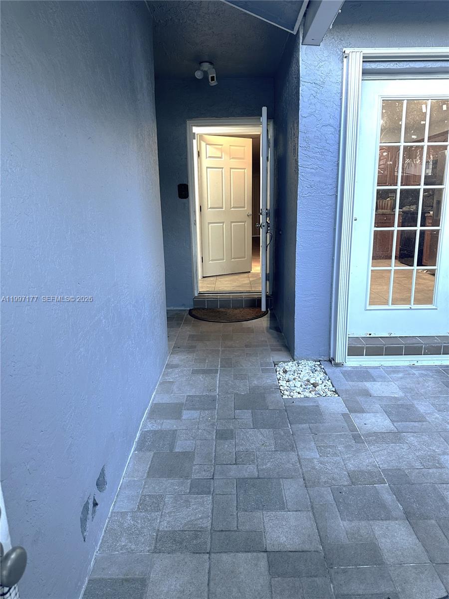 9724 Southwest 142nd Place Miami, FL 33186 - Photo 7 of 36 a view of empty room with windows