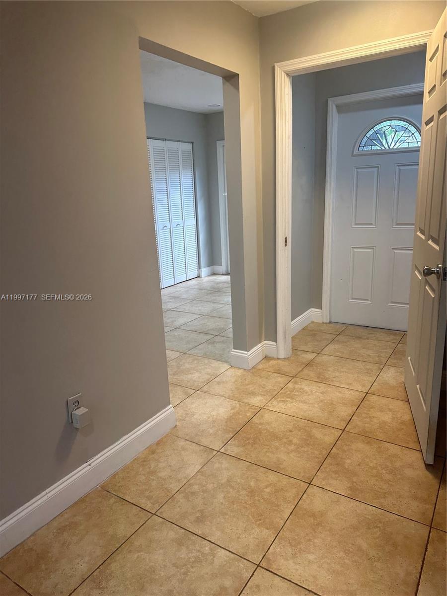 9724 Southwest 142nd Place Miami, FL 33186 - Photo 8 of 36 a view of empty room