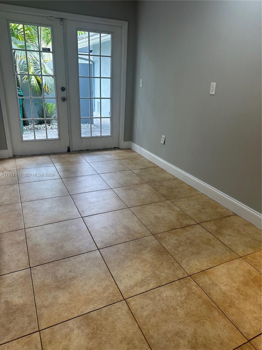 9724 Southwest 142nd Place Miami, FL 33186 - Photo 10 of 36 a view of an empty room with a window