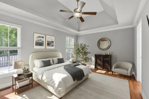 a bedroom with bed and a chandelier