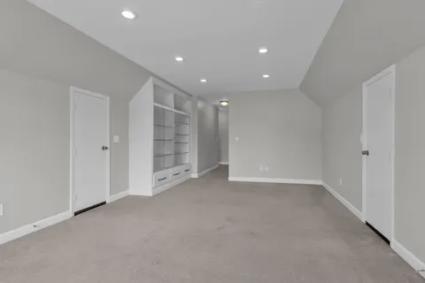 a view of an empty room with a bathroom
