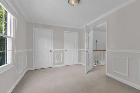 a view of empty room with windows