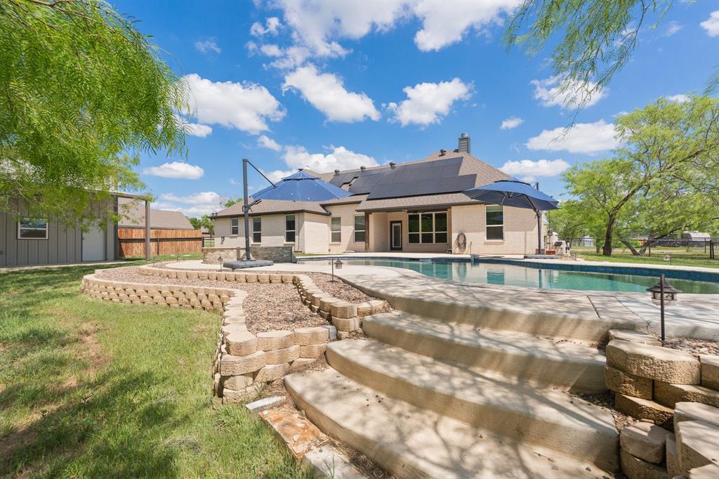 1001 Resolute Road Millsap, TX 76066 - Photo 34 of 40 a view of a house with swimming pool