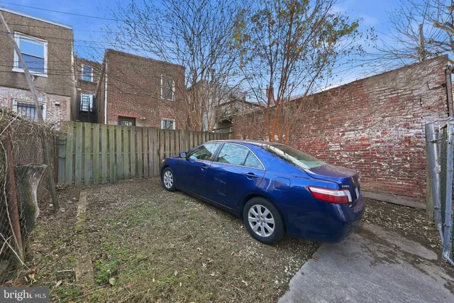 a front view of a house with parking space