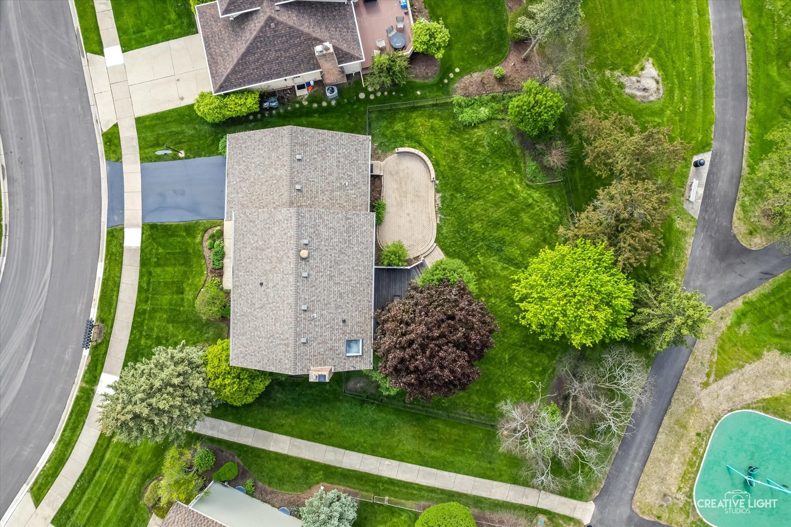 27W343 Churchill Road Winfield, IL 60190 - Photo 30 of 40 a view of a backyard with potted plants and large tree