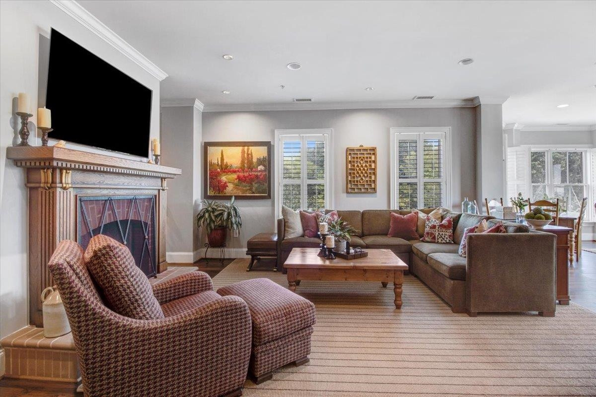 710 Independence Place, Unit 406 Raleigh, NC 27603 - Photo 11 of 50 a living room with furniture fireplace and flat screen tv