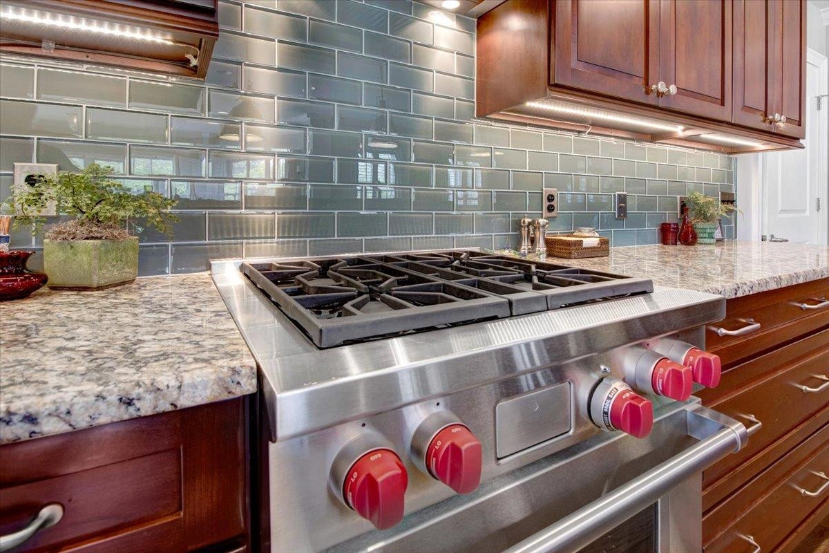 710 Independence Place, Unit 406 Raleigh, NC 27603 - Photo 17 of 50 a kitchen with a stove and cabinets