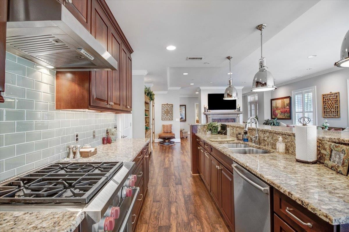 710 Independence Place, Unit 406 Raleigh, NC 27603 - Photo 18 of 50 a kitchen with lots of counter top space stove sink and cabinets