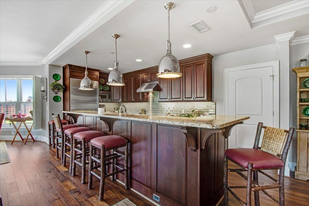 710 Independence Place, Unit 406 Raleigh, NC 27603 - Photo 24 of 50 a view of kitchen and dining area with furniture