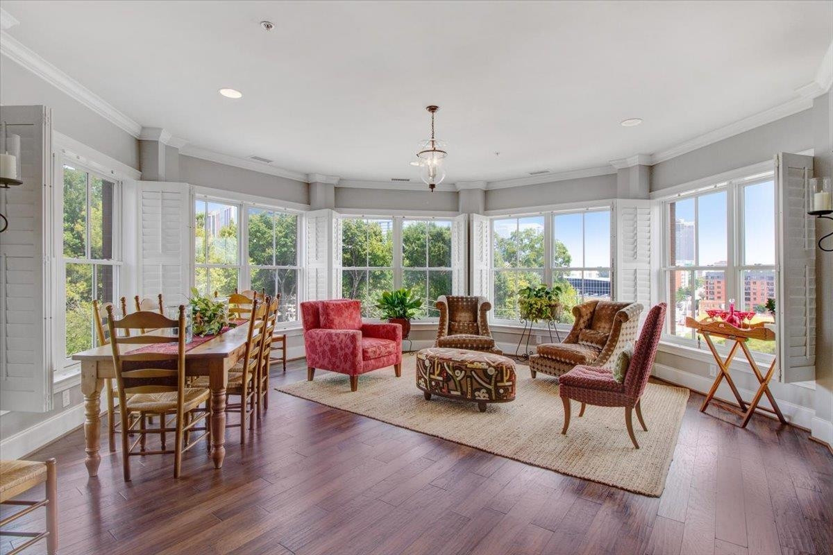 710 Independence Place, Unit 406 Raleigh, NC 27603 - Photo 25 of 50 a living room with furniture and a large window