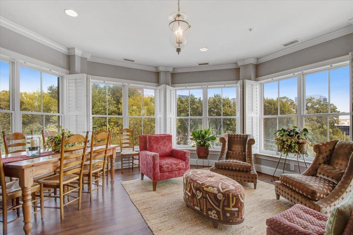 710 Independence Place, Unit 406 Raleigh, NC 27603 - Photo 26 of 50 a living room with furniture and large windows