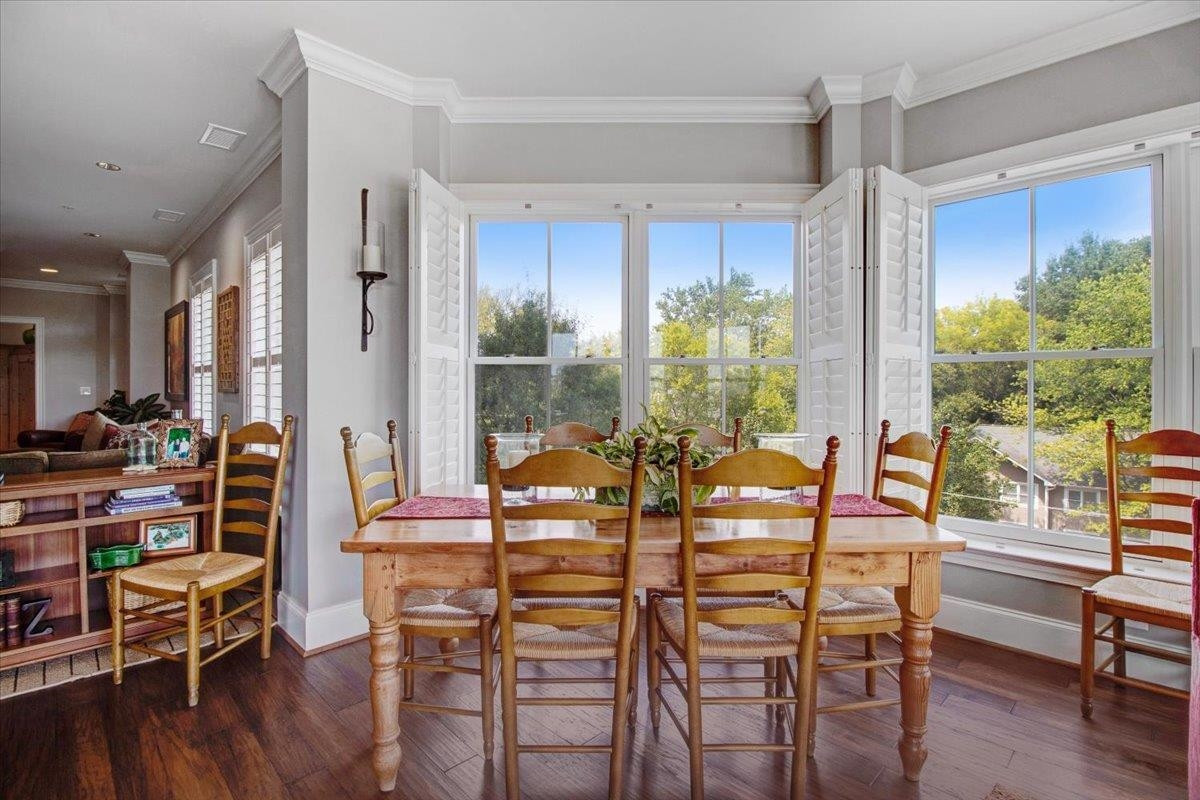 710 Independence Place, Unit 406 Raleigh, NC 27603 - Photo 27 of 50 a view of a dining room with furniture window and wooden floor
