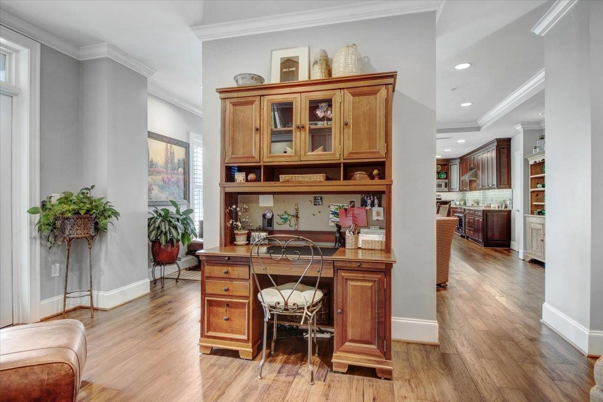710 Independence Place, Unit 406 Raleigh, NC 27603 - Photo 28 of 50 a view of a dining room with furniture and wooden floor