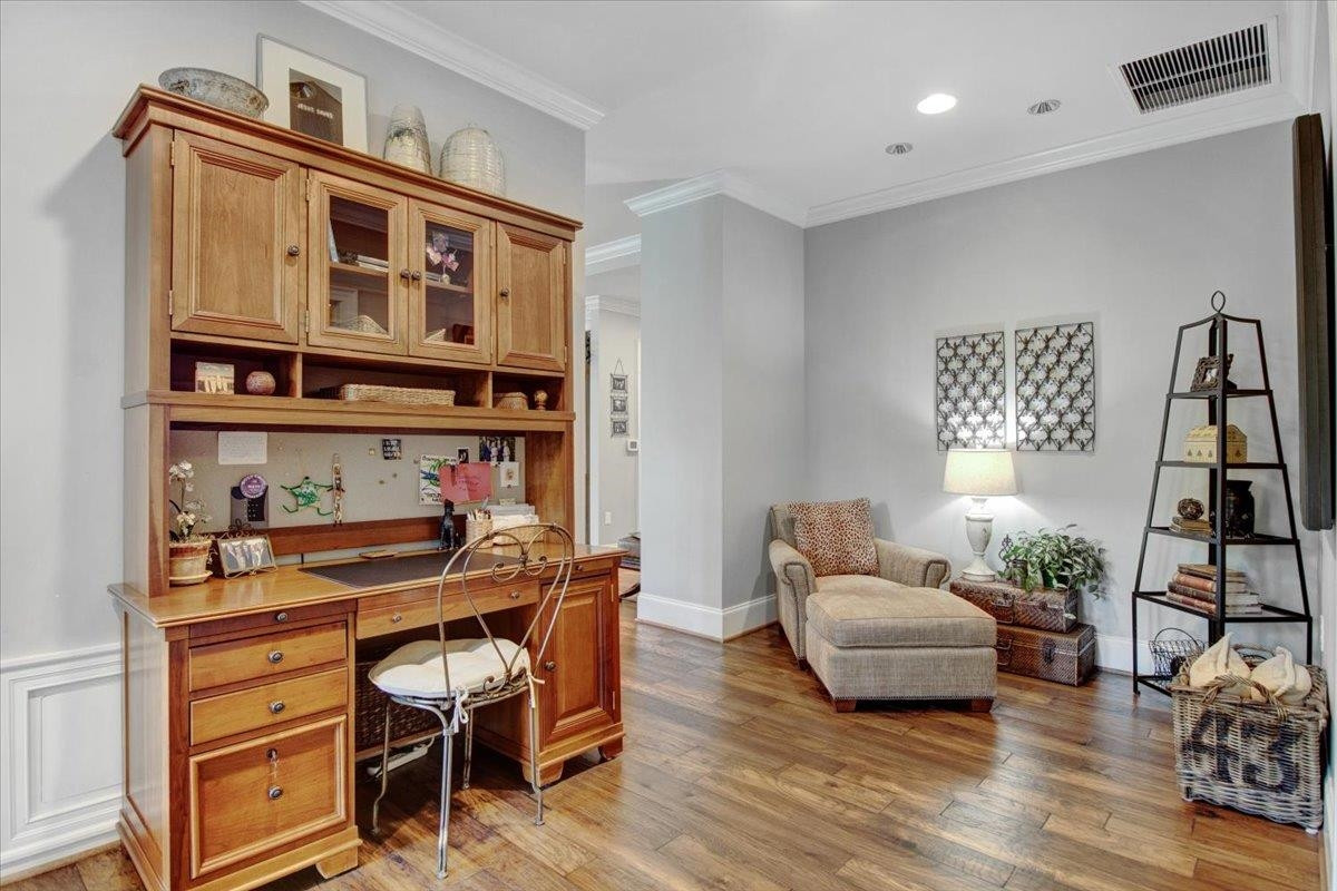 710 Independence Place, Unit 406 Raleigh, NC 27603 - Photo 29 of 50 a living room with furniture and wooden floor