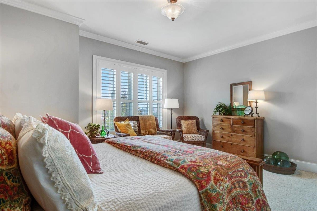 710 Independence Place, Unit 406 Raleigh, NC 27603 - Photo 33 of 50 a bedroom with a bed and a window