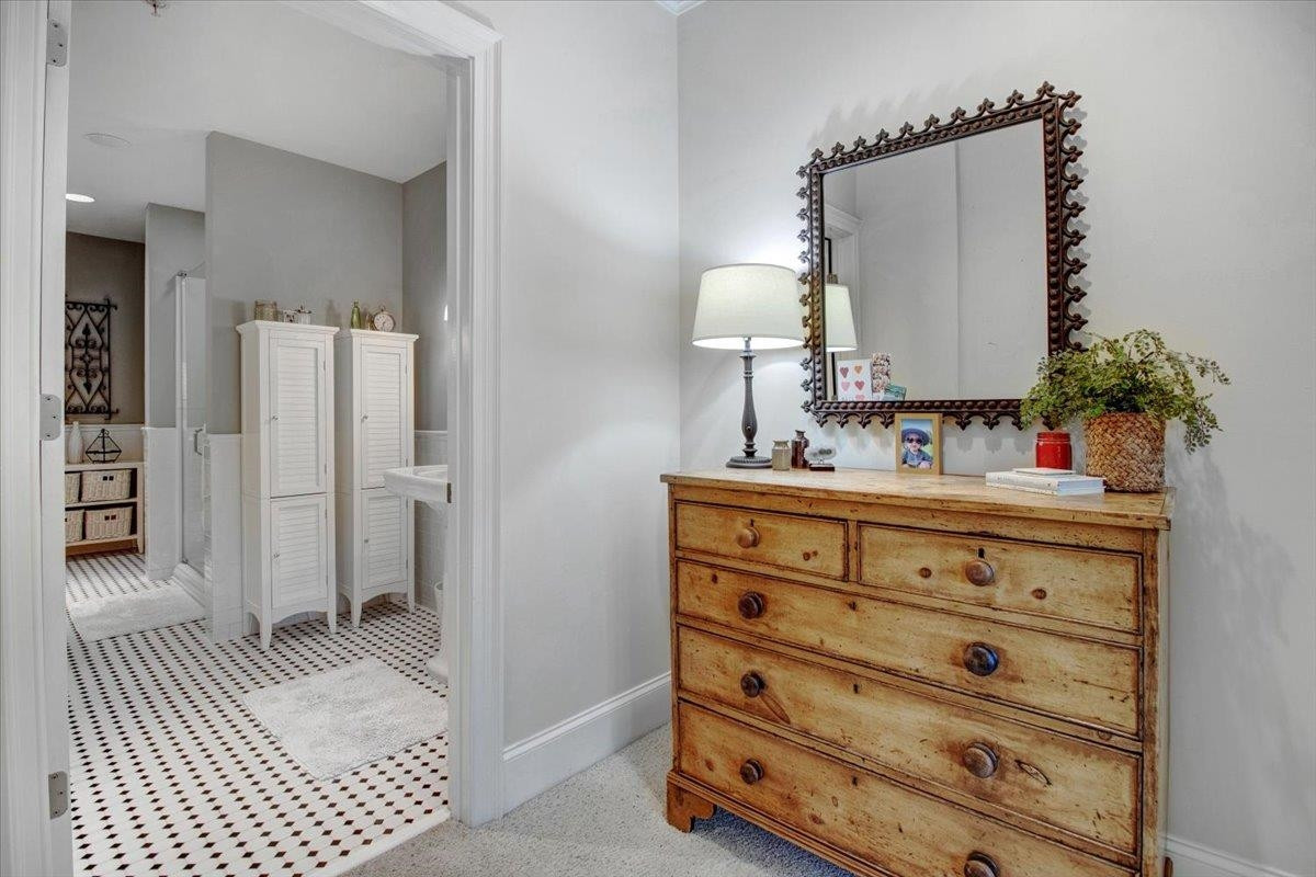 710 Independence Place, Unit 406 Raleigh, NC 27603 - Photo 35 of 50 a bathroom with a sink and a mirror