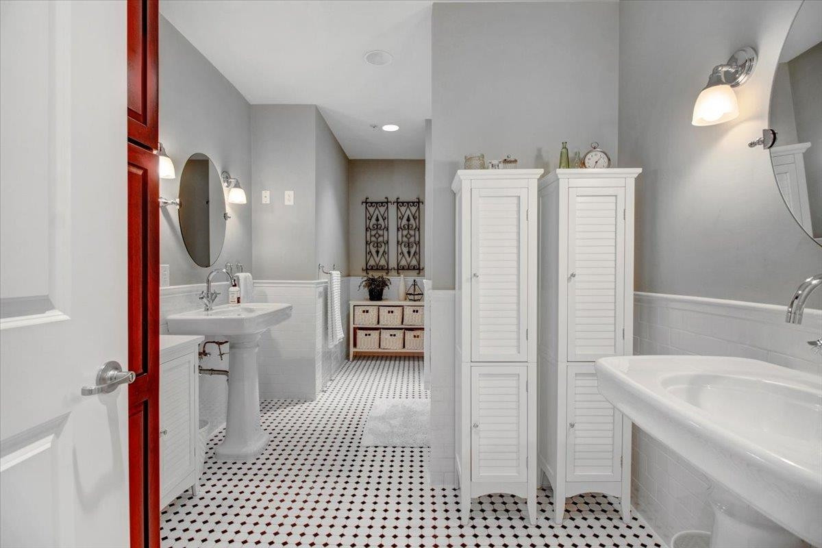 710 Independence Place, Unit 406 Raleigh, NC 27603 - Photo 37 of 50 a bathroom with a sink a toilet and shower