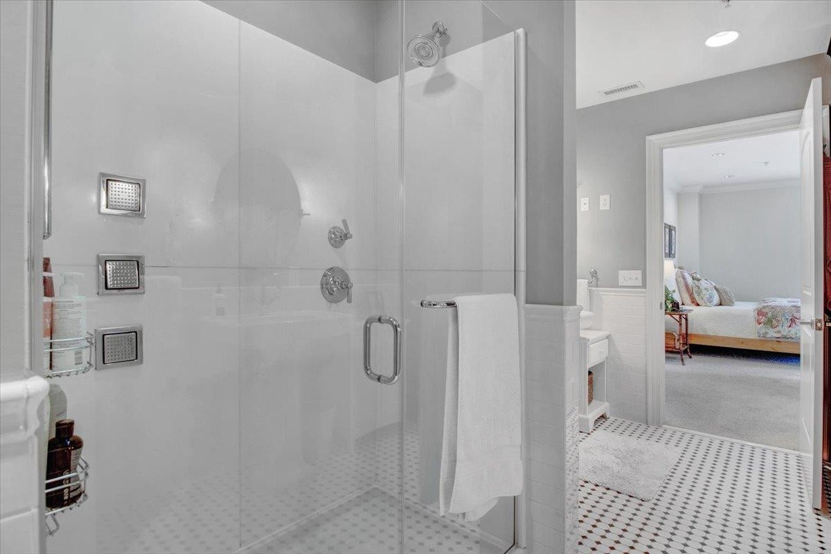 710 Independence Place, Unit 406 Raleigh, NC 27603 - Photo 39 of 50 a en suite bathroom with a shower