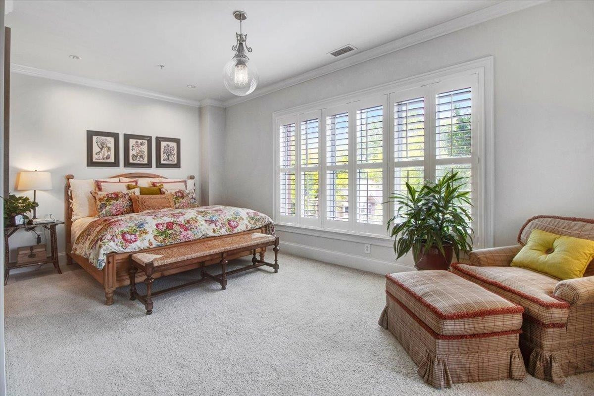 710 Independence Place, Unit 406 Raleigh, NC 27603 - Photo 40 of 50 a bedroom with bed and a window