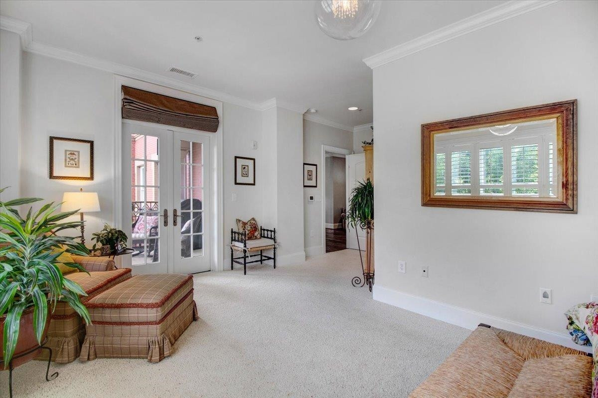 710 Independence Place, Unit 406 Raleigh, NC 27603 - Photo 42 of 50 a living room with furniture and potted plants