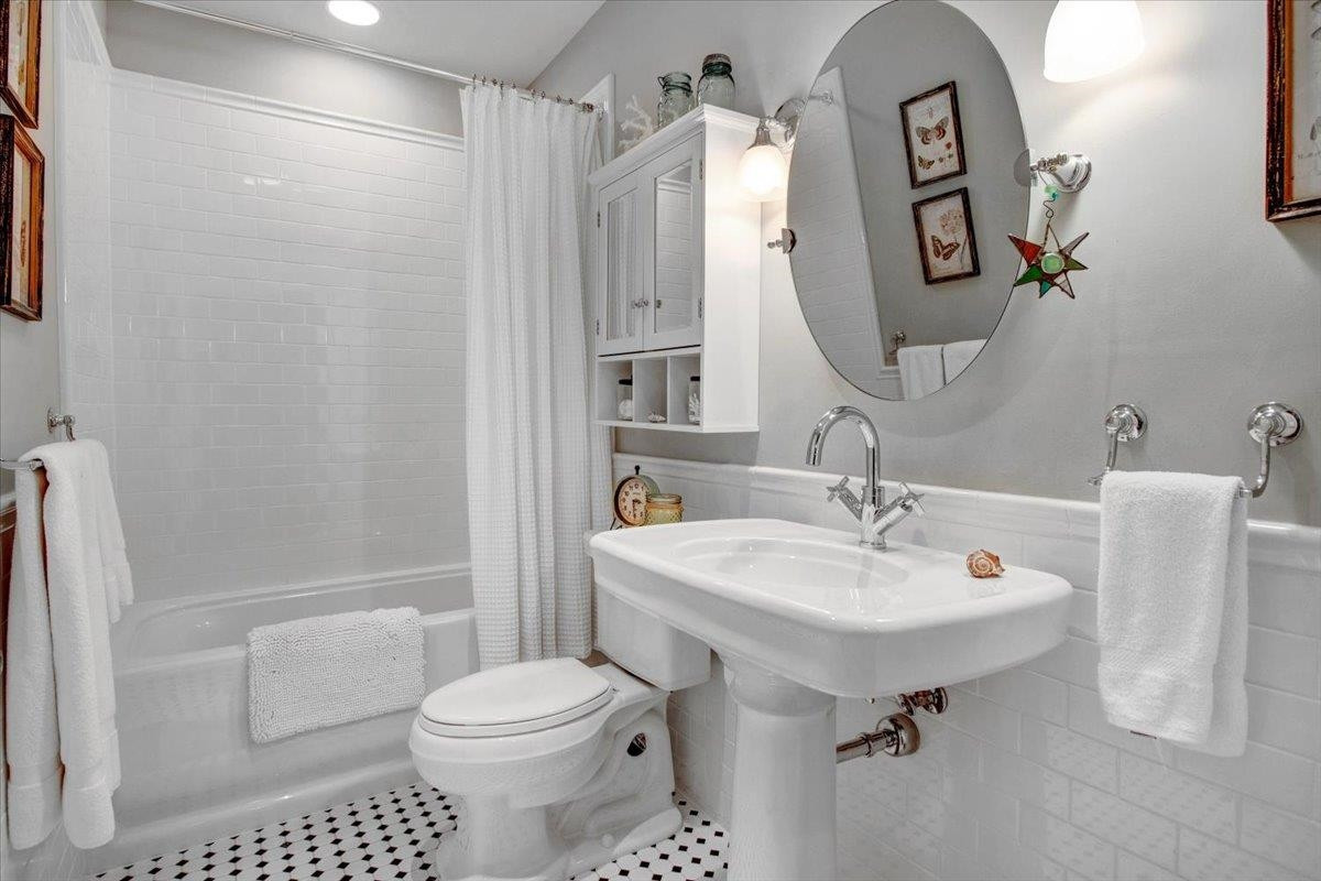 710 Independence Place, Unit 406 Raleigh, NC 27603 - Photo 46 of 50 a bathroom with a sink toilet and shower