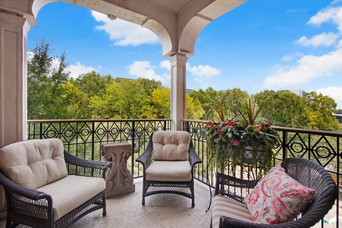 710 Independence Place, Unit 406 Raleigh, NC 27603 - Photo 48 of 50 a balcony with furniture and a potted plant