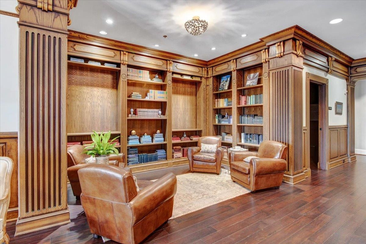 710 Independence Place, Unit 406 Raleigh, NC 27603 - Photo 6 of 50 a living room with furniture a lamp and a floor to ceiling window