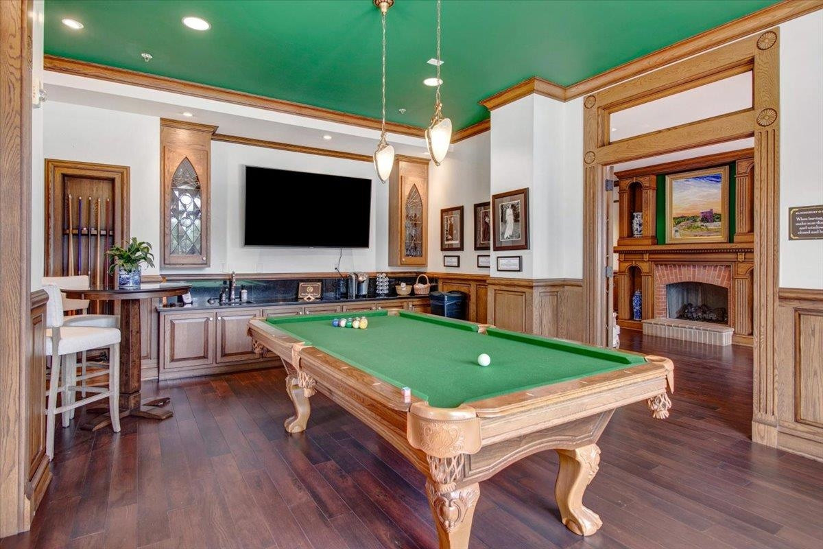 710 Independence Place, Unit 406 Raleigh, NC 27603 - Photo 9 of 50 a room with pool table flat screen tv and windows