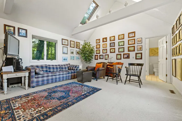 a bed room with furniture and a window