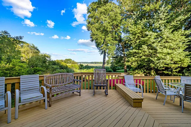 a view of sitting area with furniture on wooden deck