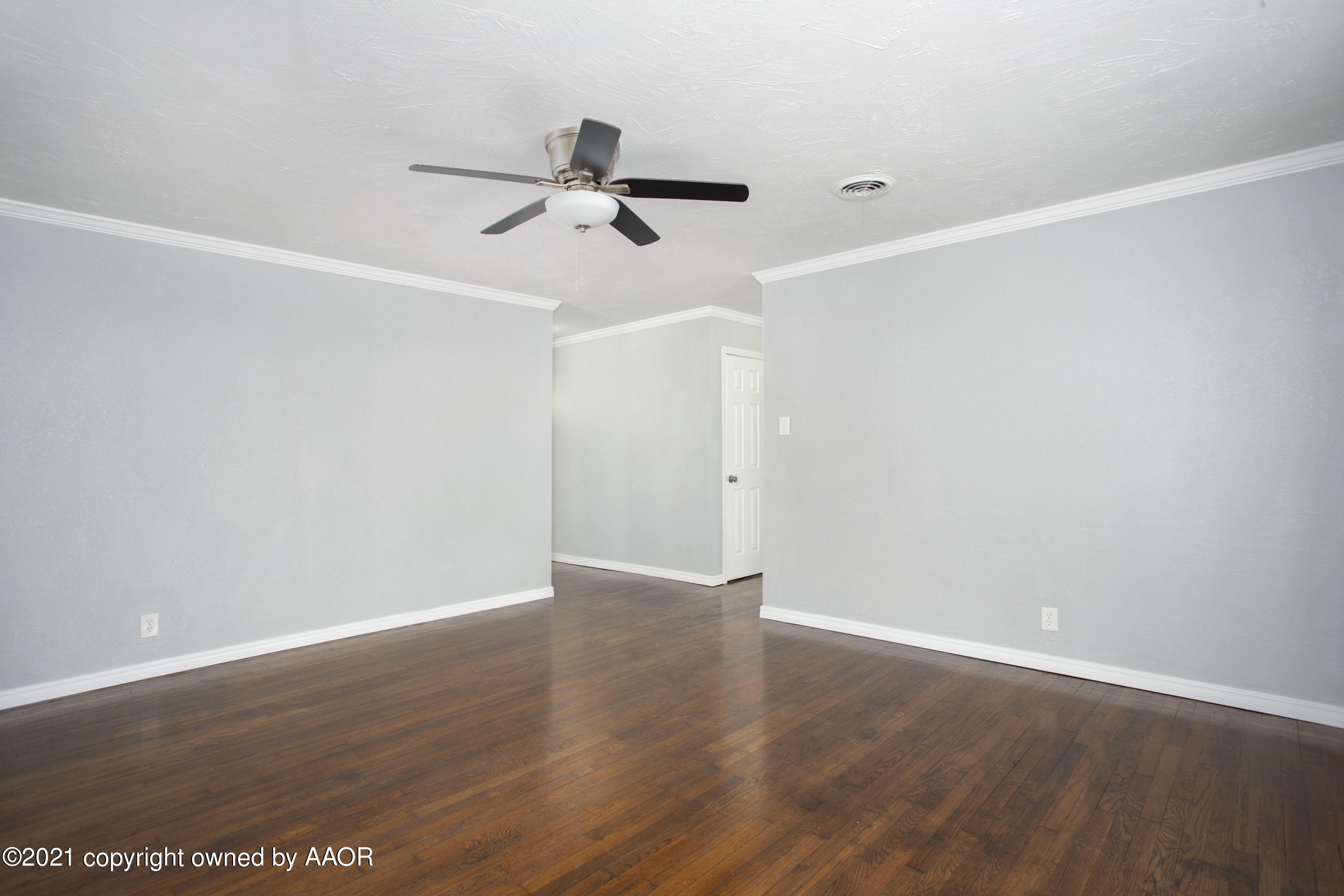 4622 South Rusk Street Amarillo, TX 79110 - Photo 5 of 22 a view of a big room with wooden floor and windows