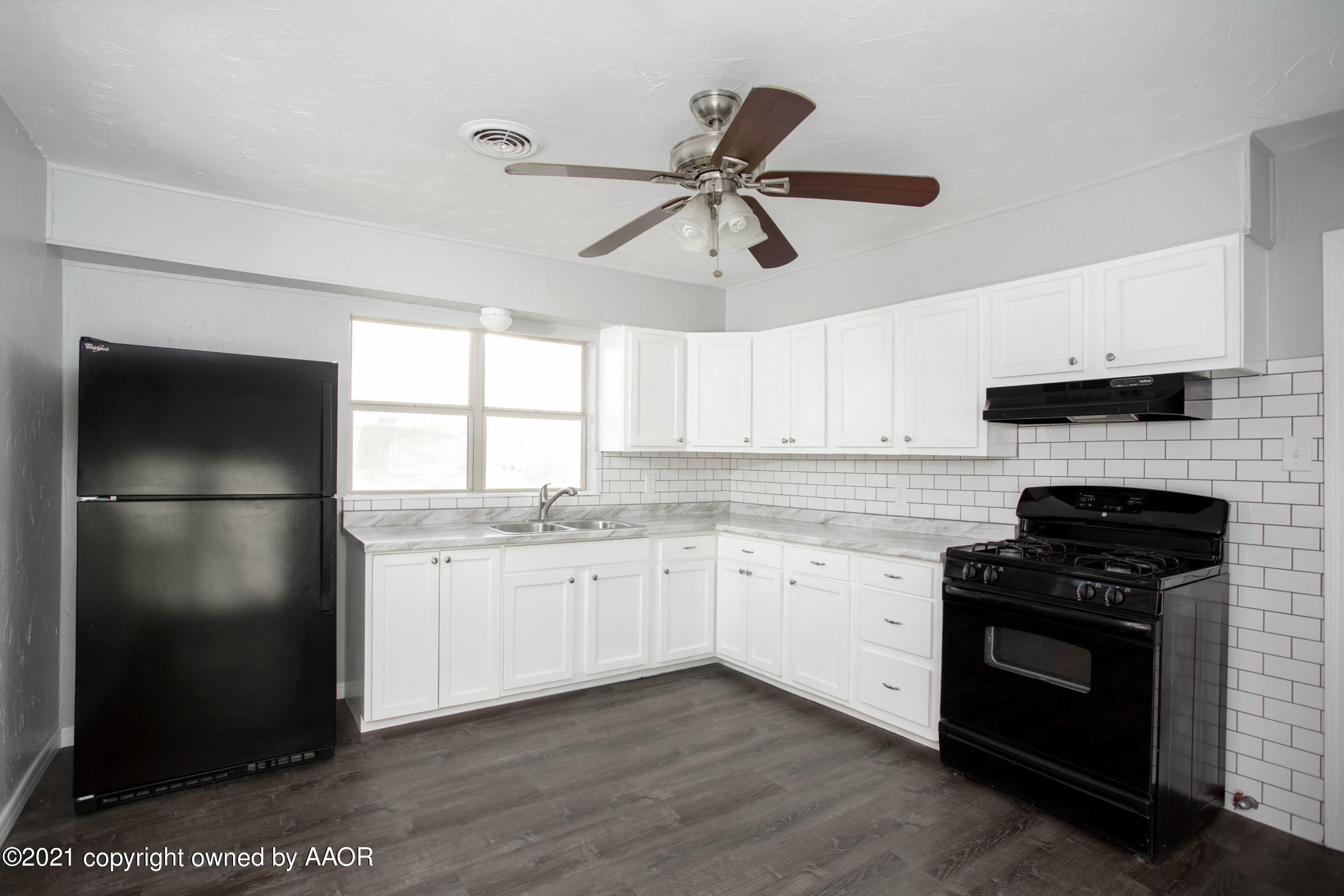 4622 South Rusk Street Amarillo, TX 79110 - Photo 8 of 22 a kitchen with a refrigerator sink and stove