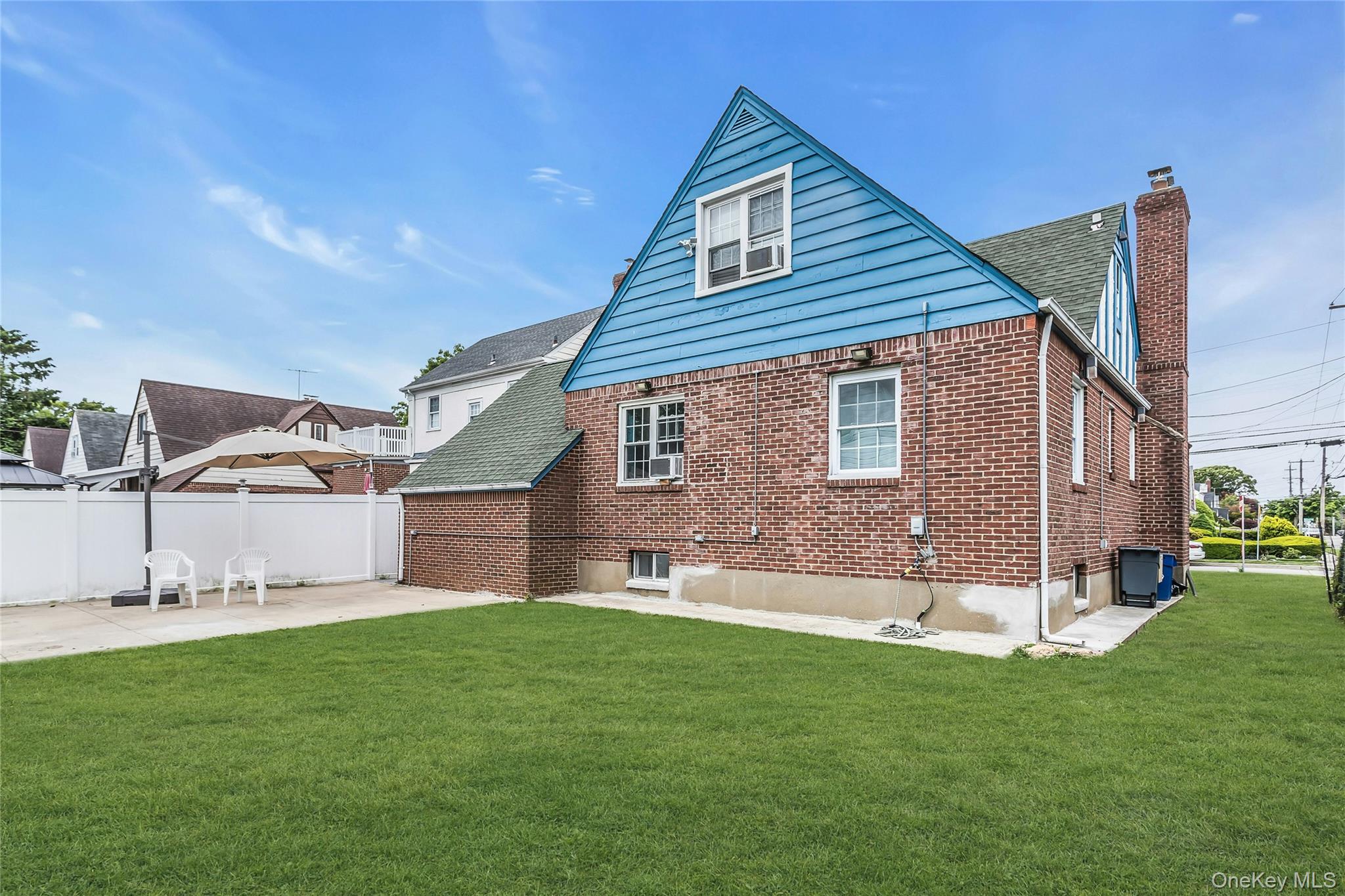 103 Union Street Valley Stream, NY 11580 - Photo 16 of 19 a view of a house with a yard and sitting area