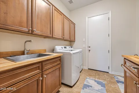 a house view with swimming pool in front of it