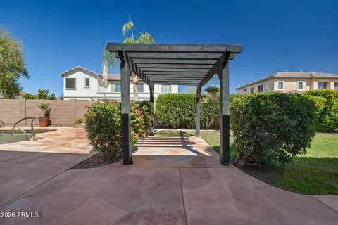 a view of a swimming pool in the backyard