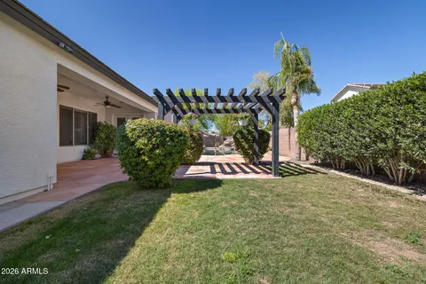 an aerial view of residential houses with outdoor space and parking