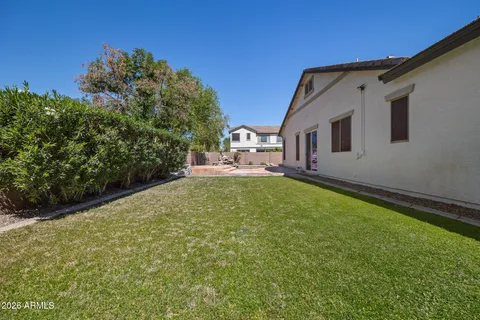 an aerial view of a house with a garden and swimming pool