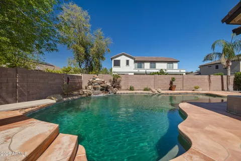 a view of a patio with table and chairs and potted plants